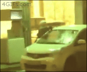 Woman_cleaning_her_car_windshield_with_gas1