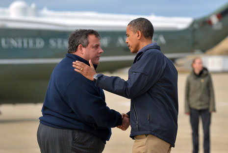 US President Barack Obama (R) is greeted by New Jersey Governor Chris Christie upon arriving in Atlantic City, New Jersey, on October 31, 2012 to visit areas hardest hit by the unprecedented cyclone Sandy. Americans sifted through the wreckage of superstorm Sandy on Wednesday as millions remained without power. The storm carved a trail of devastation across New York City and New Jersey, killing dozens of people in several states, swamping miles of coastline, and throwing the tied-up White House race into disarray just days before the vote. AFP PHOTO/Jewel Samad        (Photo credit should read JEWEL SAMAD/AFP/Getty Images)