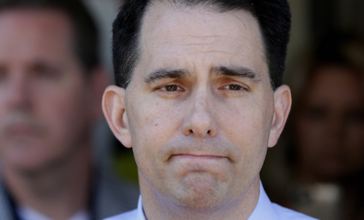 Republican presidential candidate Wisconsin Gov. Scott Walker pauses while speaking to reporters after a meet and greet visit to the Highland Park Soda Fountain in Dallas, Wednesday, Sept. 2, 2015. (AP Photo/LM Otero)