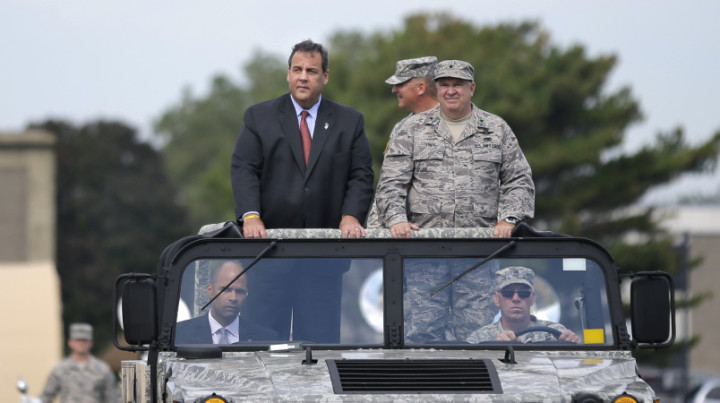 New Jersey Gov. Chris Christie New Jersey Adjutant General Brig. Gen. Michael Cunniff,right, ride in a vehicle as they review troops during the New Jersey National Guard's annual Military Review Sunday, Sept. 28, 2014, in Sea Girt, N.J. (AP Photo/Mel Evans)