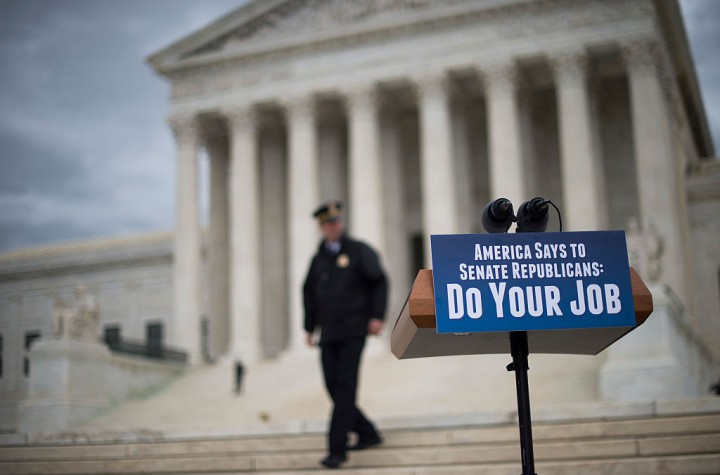 A police officer patrols the area ahead of a press conference by Senate Minority Leader Harry Reid, D-Nevada, and democratic leadership in front of the US Supreme Court on Capitol Hill in Washington, DC, February 25, 2016. 
The battle lines have been drawn between US President Barack Obama and Republican rivals in the Senate over filling a tie-breaking vacancy on the US Supreme Court. Both sides dug in hard this week over  replacing Antonin Scalia, the conservative justice who died unexpectedly February 13.

 / AFP / JIM WATSON        (Photo credit should read JIM WATSON/AFP/Getty Images)