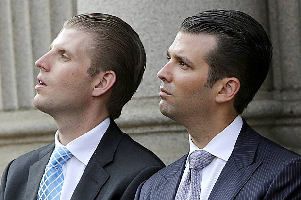 (L-R) Eric Trump, Donald Trump Jr., and Ivanka Trump attend the ground breaking of the Trump International Hotel at the Old Post Office Building in Washington July 23, 2014. The $200 million transformation of the Old Post Office Building into a Trump hotel is scheduled for completion in 2016.   REUTERS/Gary Cameron    (UNITED STATES - Tags: BUSINESS POLITICS REAL ESTATE) - RTR3ZUF0