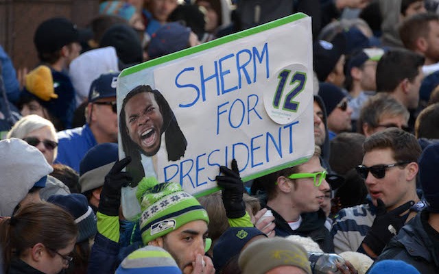 Feb 5, 2014; Seattle, WA, USA; A spectator holds a sign honoring Seattle Seahawks cornerback Richard Sherman (not pictured) at Super Bowl XLVIII victory parade on 4th Avenue. Mandatory Credit: Kirby Lee-USA TODAY Sports