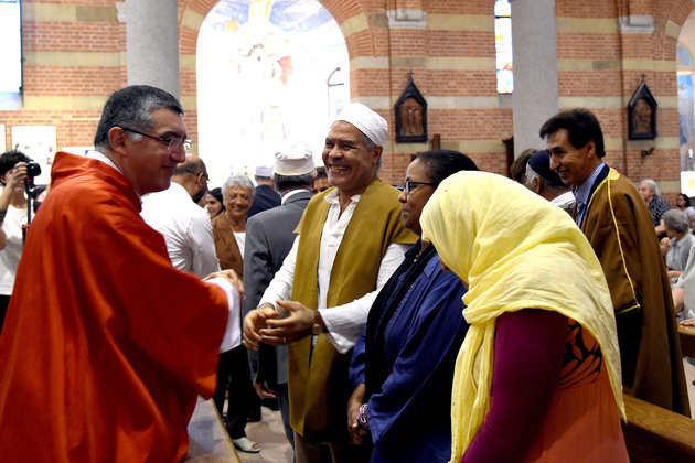 MILAN, ITALY - JULY 31:  Members of the Muslim community attend a mass in the Catholic church of Santa Maria of Caravaggio on July 31, 2016 in Milan, Italy. The Italian Muslim community have heeded the call to attend mass on Sunday to express condolences and solidarity for the murder of Father Jacques Hamel done in the church of Saint Etienne du Rouvray, in France.  (Photo by Pier Marco Tacca/Getty Images)