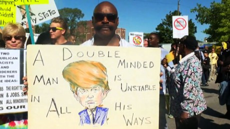 160903105945-donald-trump-protesters-outside-detroit-church-00000000-large-169[1]