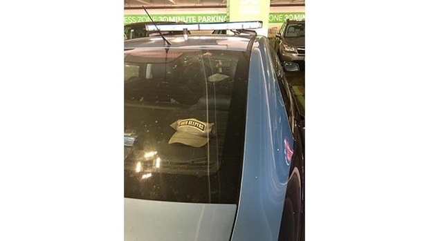oath-keepers-hat-seen-in-police-cruiser