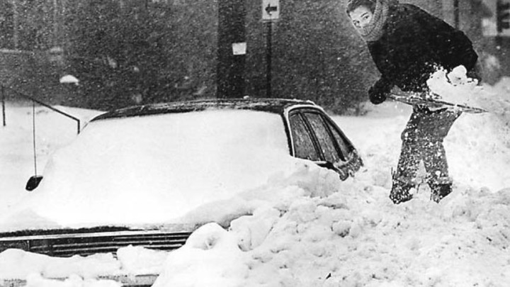 Rachel Armstrong of Duluth braved winds and snow attempting to shovel out her car. "My arms need to be strong to do this." 11-1-91, Bob King.