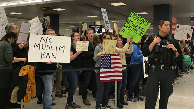 People protest against the travel ban imposed by U.S. President Donald Trump's executive order, at Washington Dulles International Airport in Dulles, Virginia, U.S. January 28, 2017.  REUTERS/Yeganeh Torbati
