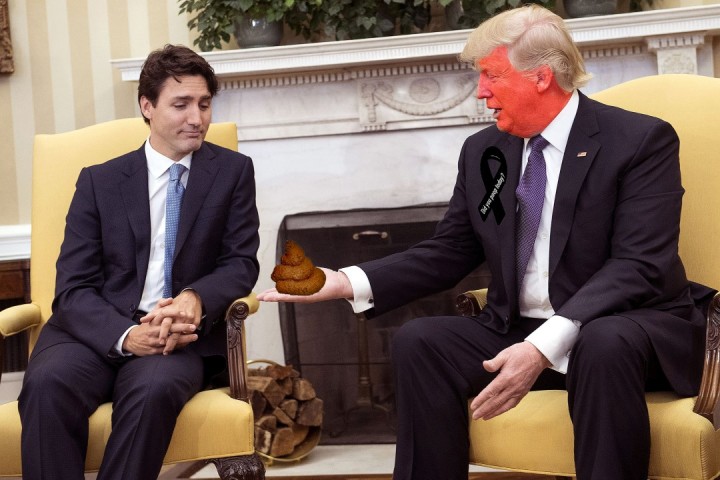 U.S. President Donald Trump, right, extends his hand to Justin Trudeau, Canada's prime minister, during a meeting in the Oval Office of the White House in Washington, D.C., U.S, on Monday, Feb. 13, 2017. Trump's pledge to renegotiate the North American Free Trade Agreement and his support for a "major border tax" threatens to disrupt $541 billion in trade between the two countries, potentially driving up costs and crimping profits for some of Canada's biggest companies including Suncor Energy Inc. and auto parts supplier Magna International Inc. Photographer: Kevin Dietsch/Pool via Bloomberg