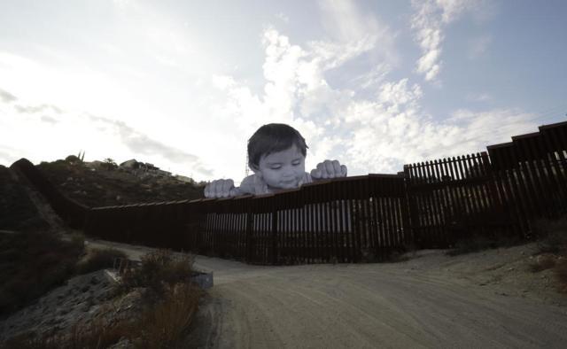 BC-US-Border-Wall-Peering-Toddler-IMG-jpg-640x394