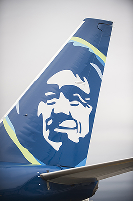 An Alaska Airlines Boeing 737-800 painted with the airline's new tail logo and livery Tuesday, Jan. 26, 2016, at Seattle-Tacoma International Airport in Seattle. This month, Alaska Airlines revealed the most substantial updates to its brand in a quarter century. Beginning Jan. 25, Alaska fliers will see the visual updates in new signage at the airport, an all-new airplane paint job, a refreshed website and mobile app, and more.